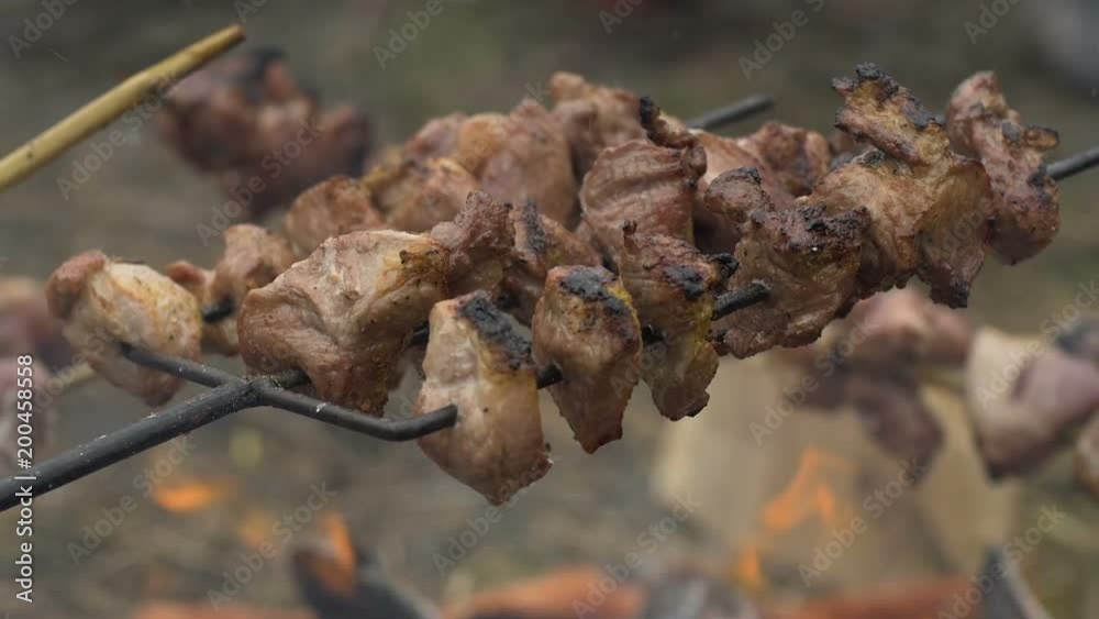 Frying shish kebabs on barbecue fork.
