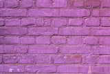 Pink painted brick wall for creativity, textures and backgrounds. Close-up image of painted brick surface.