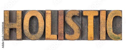 holistic - word abstract in wood type