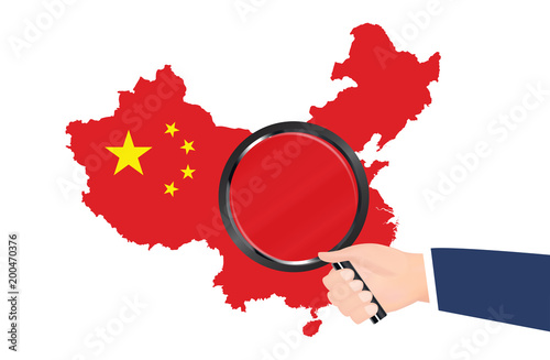 china map flag with hand hold magnifying glass