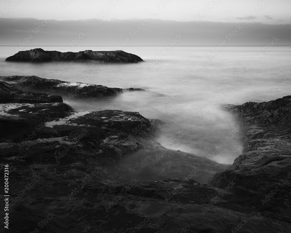 Black and white long exposure of sea rocks in the morning, Kanagawa Prefecture, Japan