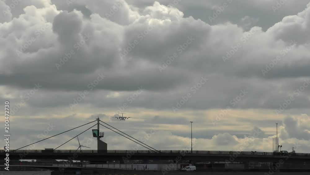 Dramatic clouds over an airport. A passenger plane landing. Dramatic clouds over an airport. A passenger plane landing.