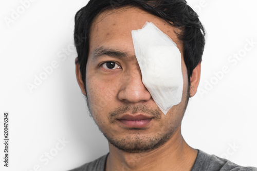 Photo White medicine plaster patch on the eye