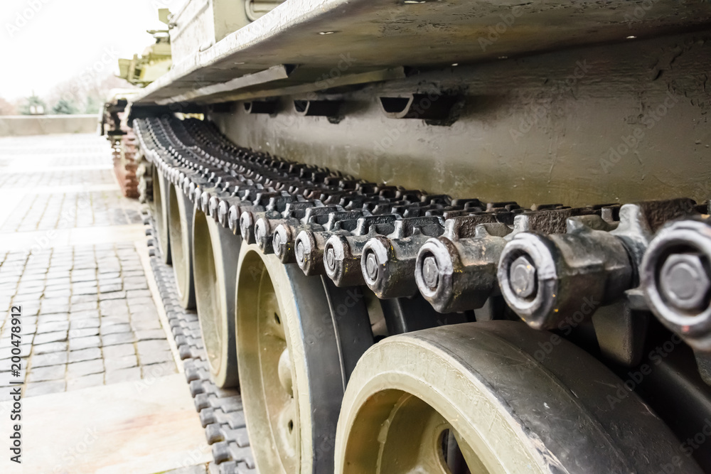 Caterpillar of a military tank or excavator. Close-up photo