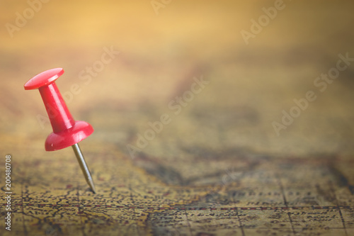 red pin on vintage map