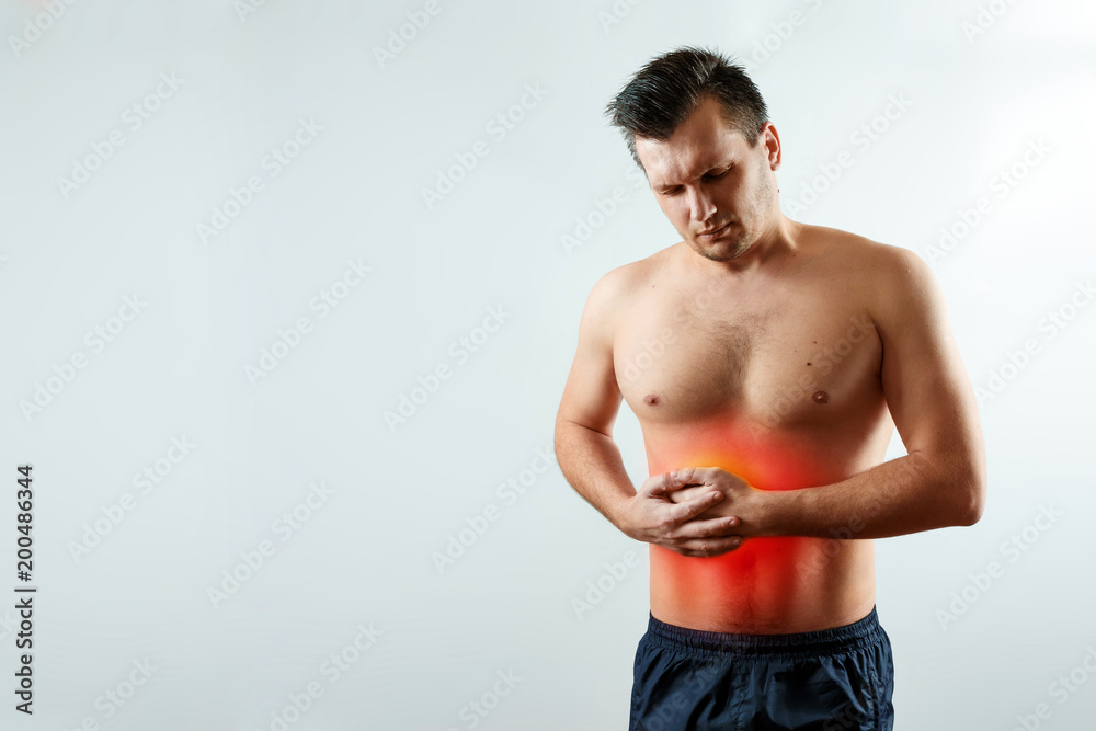 Front view, the man holds hands for his side in the liver's rena, liver