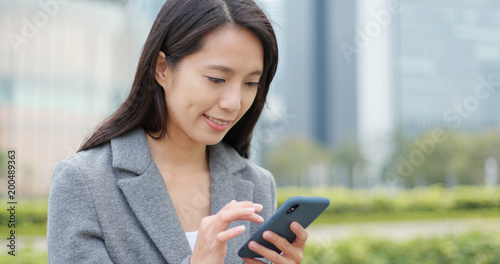 Business woman work on smart phone at outdoor