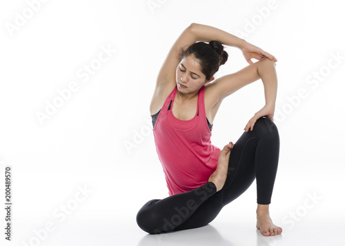   Young woman doing yoga, India