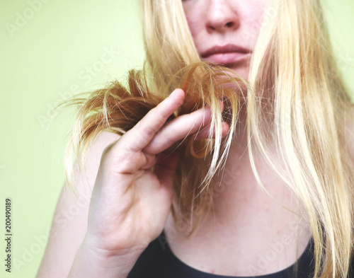 Damaged Hair. Beautiful Sad Young Woman With Long Disheveled Hair. Hair Damage, Health And Beauty Concept