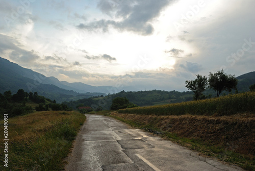 Mountain landscape and road trough a countryside
