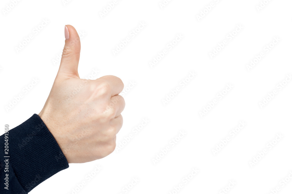 Female hand shows thumb up gesture and sign. Isolated on white background. Dark blue pullover. copy space, template