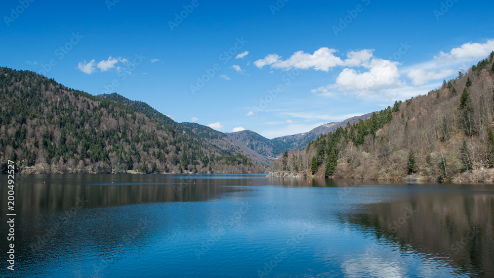 panorama of lake of Kruth with clouds reflection in alsace - France