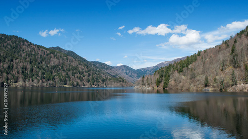 Fototapeta Naklejka Na Ścianę i Meble -  panorama of lake of Kruth with clouds reflection in alsace - France