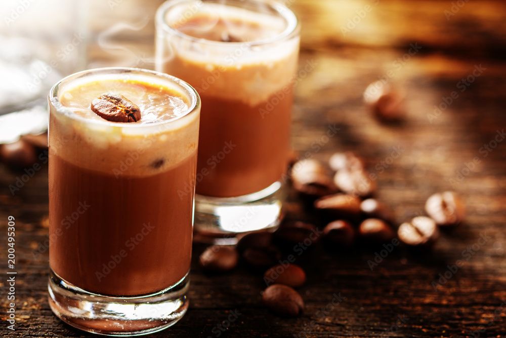 Cappuccino and coffee beans on wood Cappuccino and coffee beans on wood