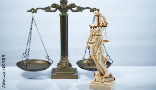 Law symbols on bright background.  Scale of justice