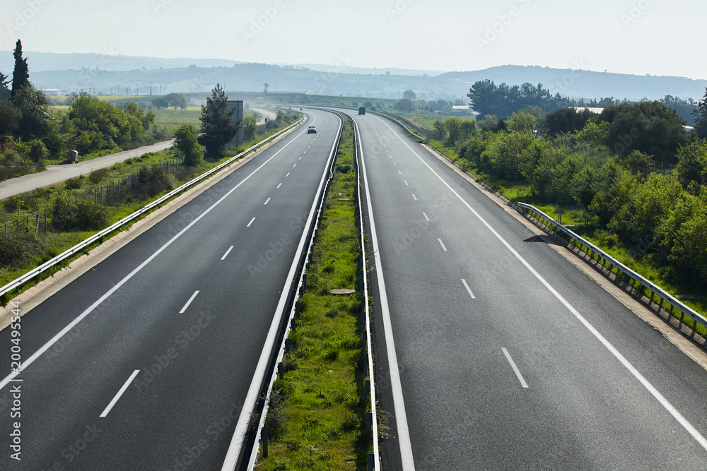 Highway traffic in sunset with cars and trucks Highway traffic in sunset with cars and trucks