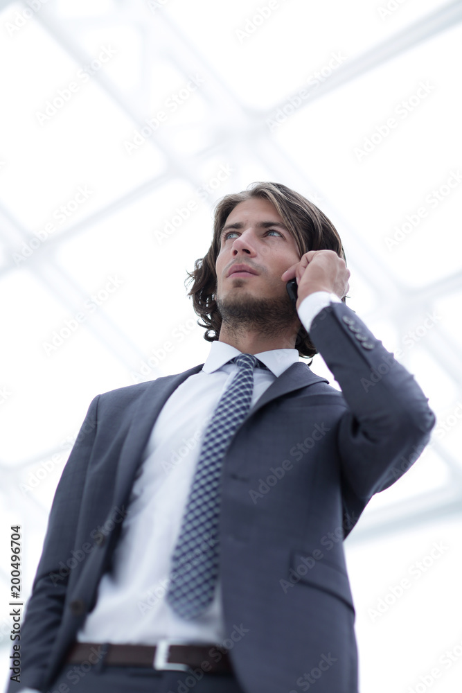 businessman talking on mobile .isolated on white. businessman talking on mobile .isolated on white.
