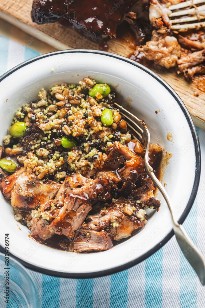 Fototapeta premium Superfood: couscous, lentils & edamame soybeans with slow cooked pulled pork in hoisin sauce. 