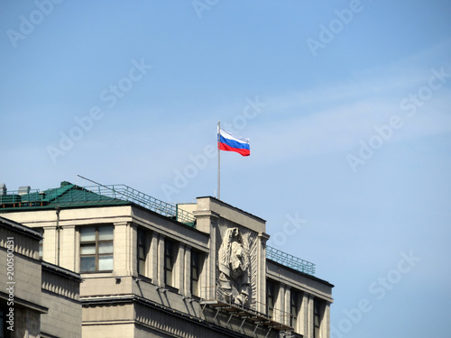 Russian flag over the building of Russian Parliament in Moscow