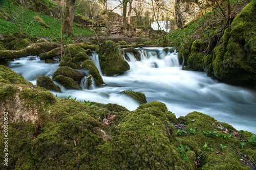 Long exposure of water coming over a waterfall at Janet s Foss in Yorkshire
