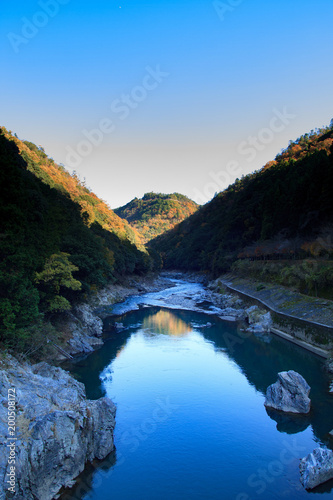 Hozugawa river surrounded by mountains in Kyoto, Japan