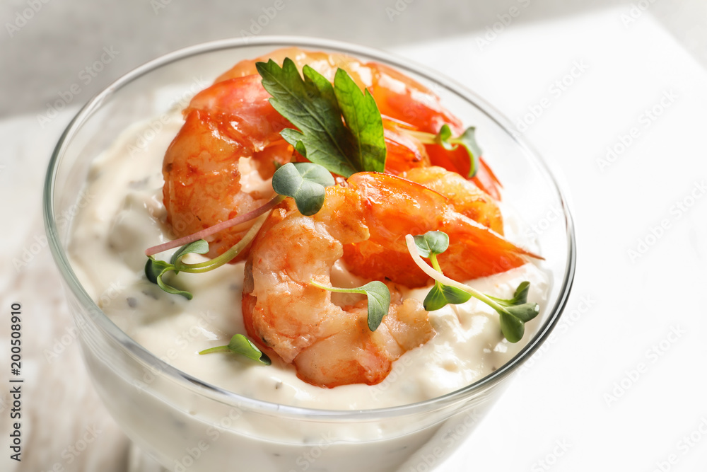 Bowl with fried shrimps and sauce on light background Bowl with fried shrimps and sauce on light background