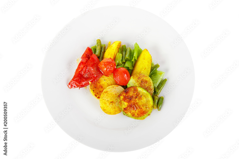 Vegetables grilled portion of side dish on a plate on white isolated background view from above. Appetizing dish for the menu restaurant, bar, cafe Vegetables grilled portion of side dish on a plate on white isolated background view from above. Appetizing dish for the menu restaurant, bar, cafe
