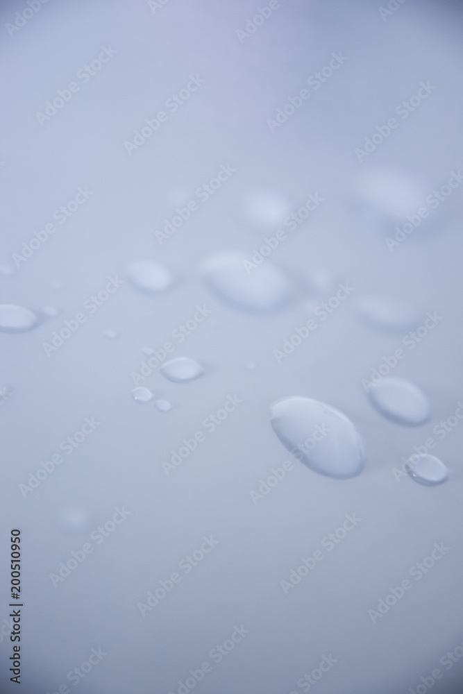 water drops on white surface water drops on white surface