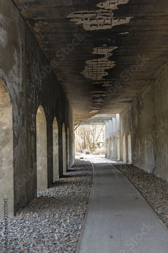 Abandoned railway underpass of a former freight yard from the end of the 19th century in Berlin, which is now used as a footpath