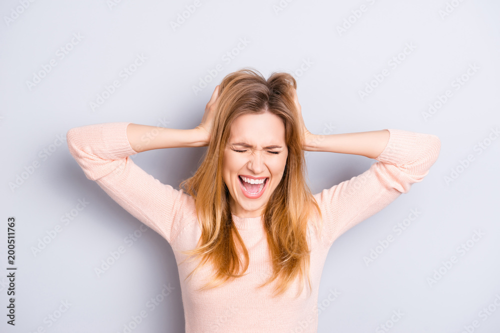 People casual sweater pullover person emotion expressing open mouth closed eyes concept. Close up portrait of angry exhausted upset sad unhappy lady touching head isolated on gray background People casual sweater pullover person emotion expressing open mouth closed eyes concept. Close up portrait of angry exhausted upset sad unhappy lady touching head isolated on gray background
