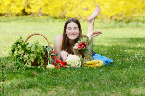 Beautiful attractive young woman holding healthy detox vegetable. Healthy lifestyle concept. © Alena