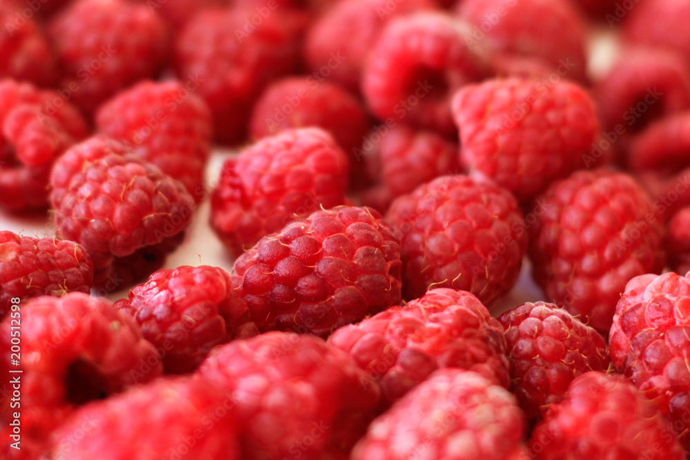 Heap of raspberries full frame used as background, close-up Heap of raspberries full frame used as background, close-up