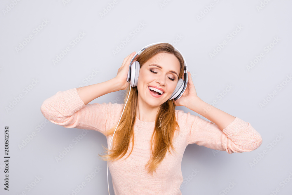 Weekend holiday day vacation day-off youth concept. Portrait of excited cheerful glad active beautiful lady enjoying favorite music isolated on gray background touching headphones copy-space Weekend holiday day vacation day-off youth concept. Portrait of excited cheerful glad active beautiful lady enjoying favorite music isolated on gray background touching headphones copy-space