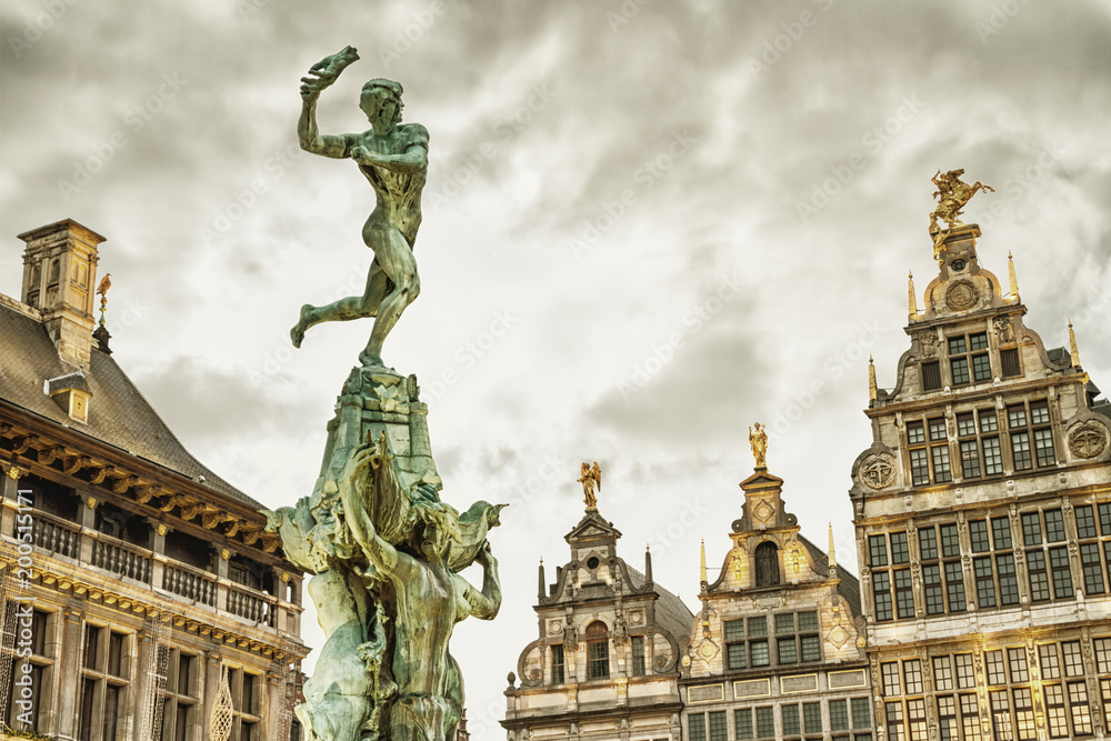 Cityscape - view of the Brabo fountain and a building the Guildhouses decorated with sculpture St. George, the Grote Markt (Main Square) of Antwerp, in Belgium