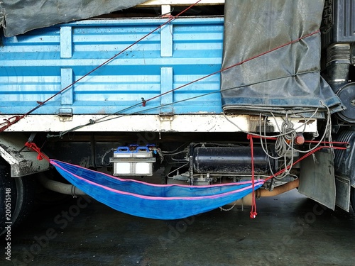 blue cradle beside truck 