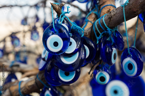 a tree hung with evil eyes in the volcanic sculpted region of Cappadocia photo