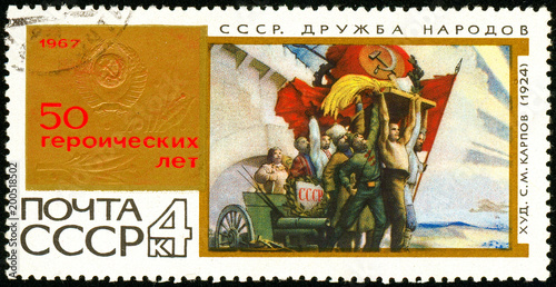 Ukraine - circa 2018: A postage stamp printed in USSR show Painting by artist Karpov Friendship of Peoples. Series: 50th Anniversary of October Revolution. Circa 1967