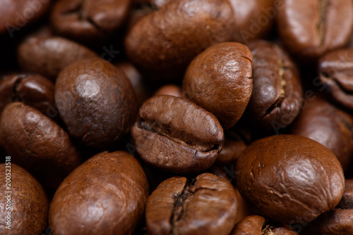 full frame of roasted coffee beans backdrop
