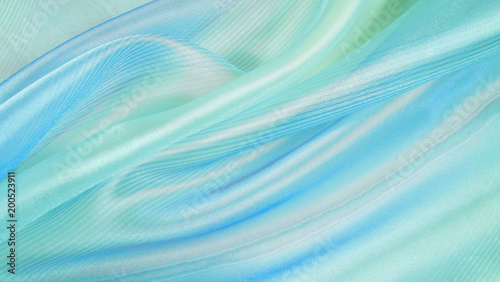 Abstract blue background made of light fabric. © NADEZHDA
