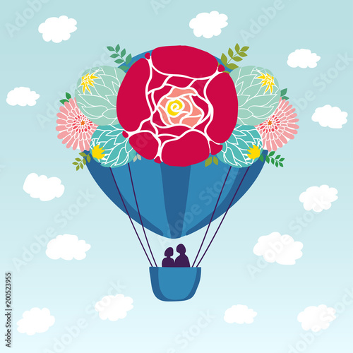 A blue aerostat balloon in the sky among the clouds and birds. The ball is decorated with flowers, leaves and berries. In the basket there are 2 people, a couple in love. Vector color illustration.