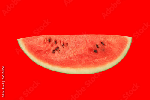 water melon slice isolated on red background