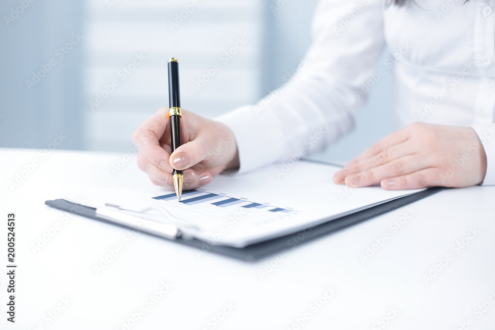 business woman analyzing the financial schedule business woman analyzing the financial schedule