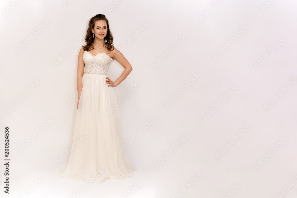 beautiful bride in white wedding dress in different poses on white backgrounds shows different emotions beautiful bride in white wedding dress in different poses on white backgrounds shows different emotions