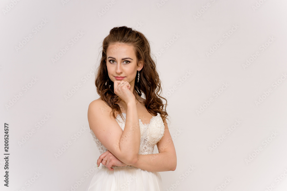 beautiful bride in white wedding dress in different poses on white backgrounds shows different emotions beautiful bride in white wedding dress in different poses on white backgrounds shows different emotions