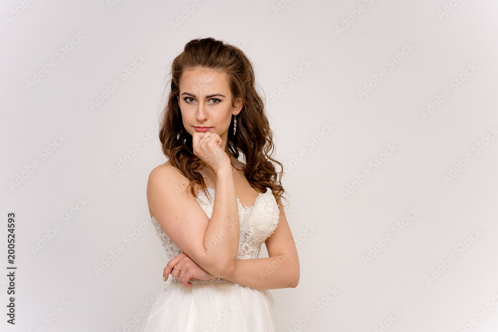 beautiful bride in white wedding dress in different poses on white backgrounds shows different emotions beautiful bride in white wedding dress in different poses on white backgrounds shows different emotions