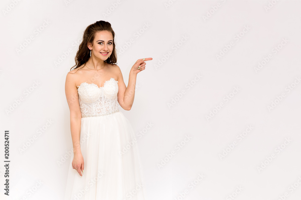 beautiful bride in white wedding dress in different poses on white backgrounds shows different emotions beautiful bride in white wedding dress in different poses on white backgrounds shows different emotions