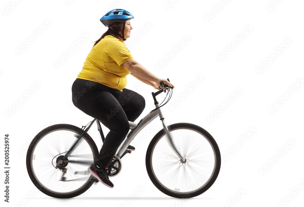 Overweight woman riding a bicycle Overweight woman riding a bicycle
