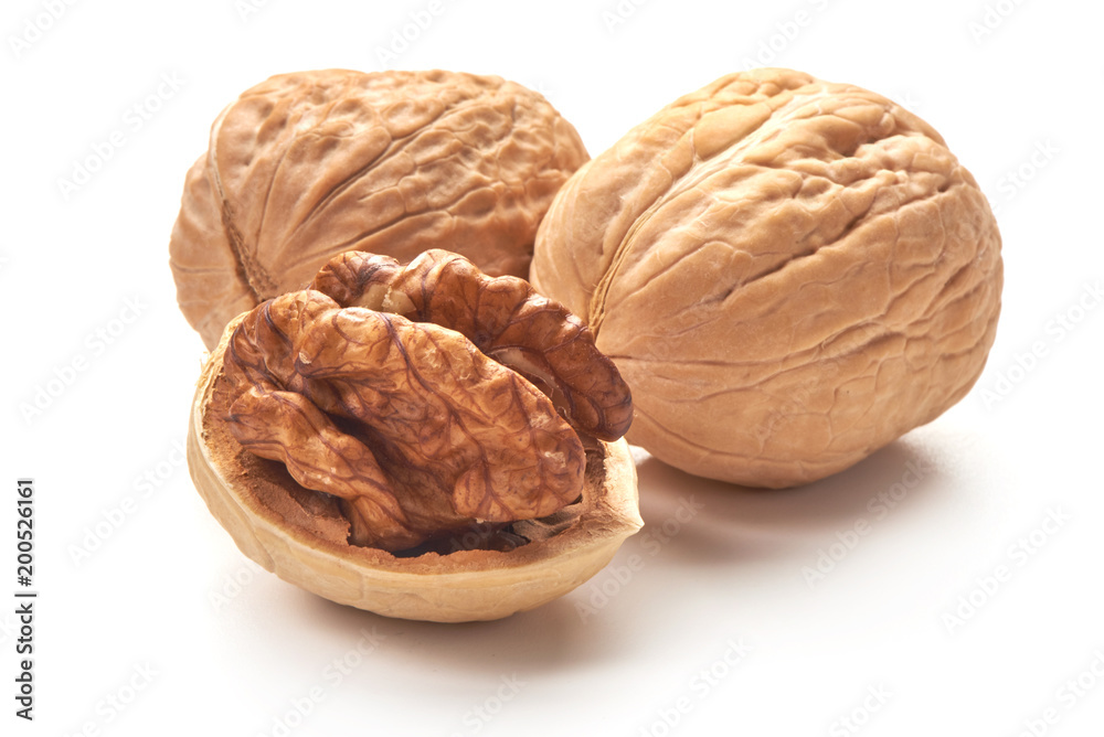 Useful walnuts, close-up, isolated on white background. Useful walnuts, close-up, isolated on white background.