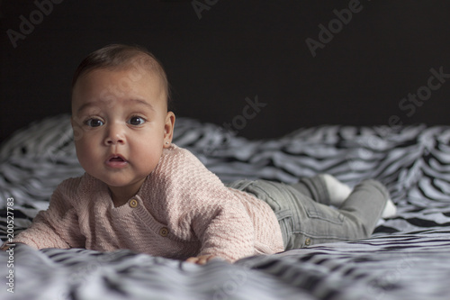 Baby girl on bed