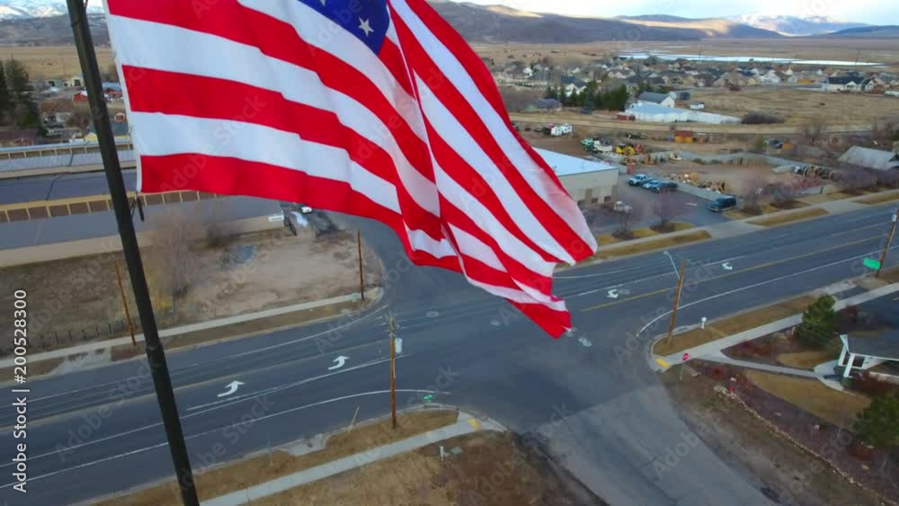 Up American Flag over a small town